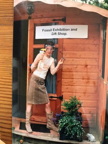 A young Lucy Baehren photographed in front of her garden shed “Fossil Exhibition and Gift Shop”