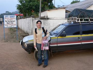 Susana on the way to Bossou in 2008, using a bush taxi and holding tight to water and toilet paper! Photo by Kat Koops